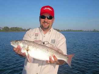 Angler holding a fat redfish