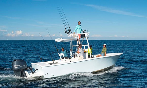 Capt. Todd's 22-foot bay boat running across emerald Gulf water